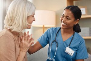 Care staff member reviewing a personalized care plan with an older resident at a table.